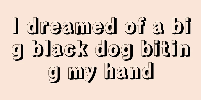 I dreamed of a big black dog biting my hand