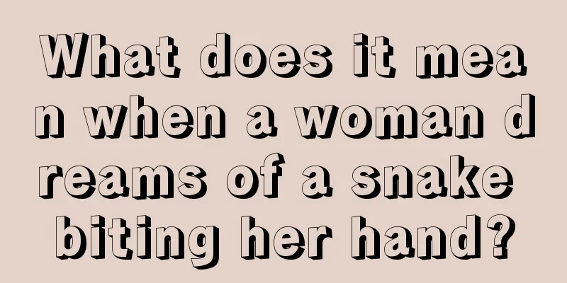 What does it mean when a woman dreams of a snake biting her hand?