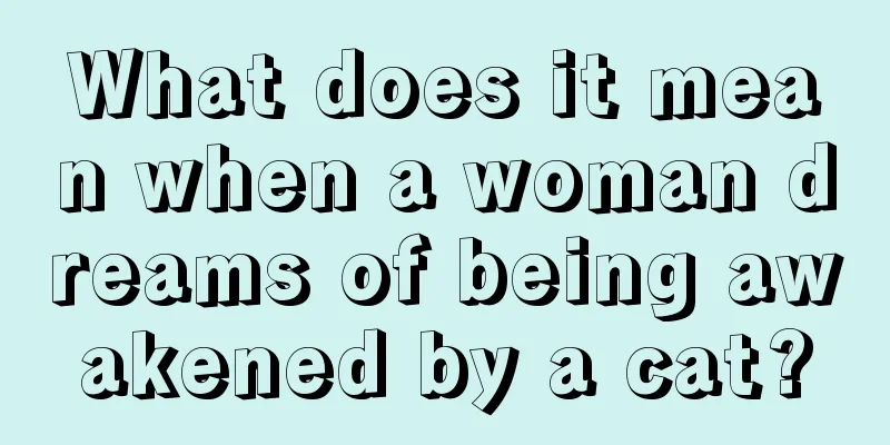 What does it mean when a woman dreams of being awakened by a cat?