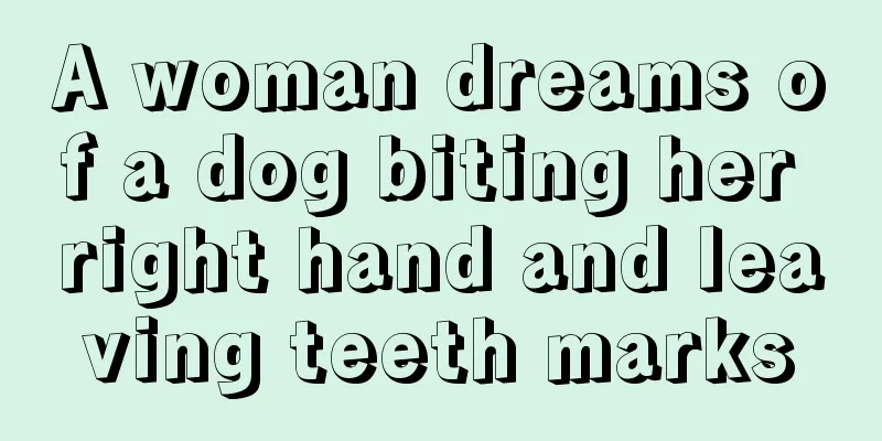 A woman dreams of a dog biting her right hand and leaving teeth marks