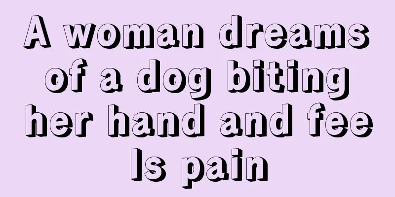 A woman dreams of a dog biting her hand and feels pain