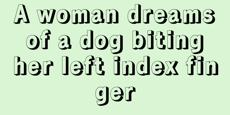 A woman dreams of a dog biting her left index finger