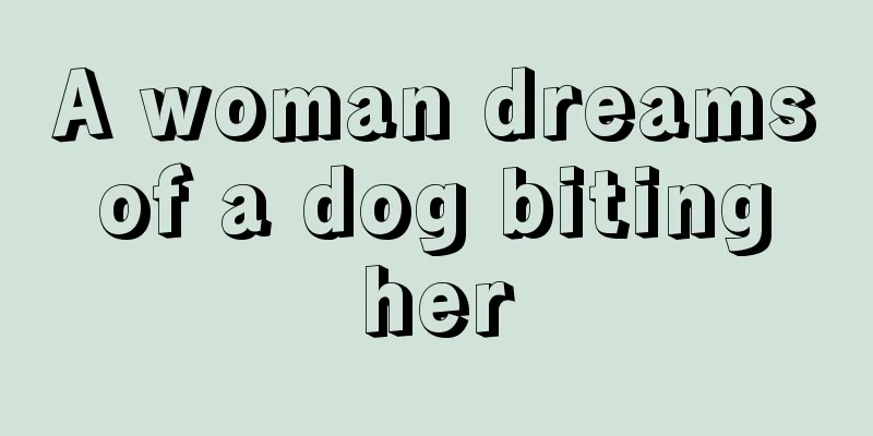 A woman dreams of a dog biting her