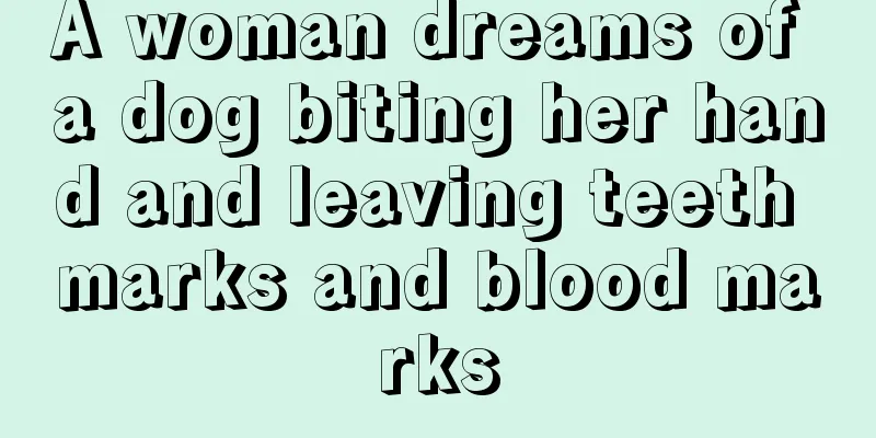 A woman dreams of a dog biting her hand and leaving teeth marks and blood marks