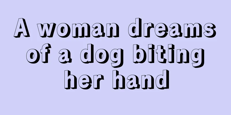 A woman dreams of a dog biting her hand