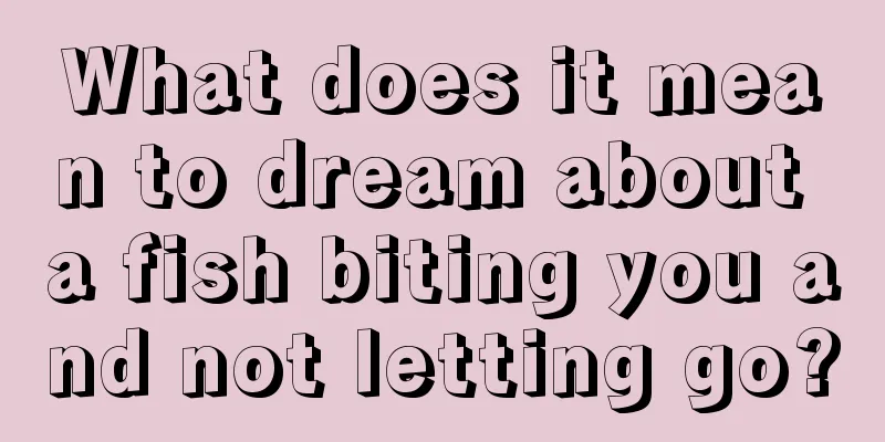 What does it mean to dream about a fish biting you and not letting go?