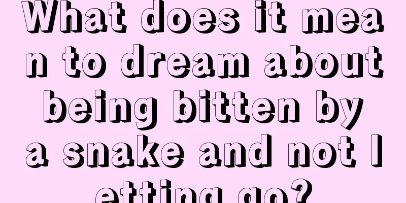 What does it mean to dream about being bitten by a snake and not letting go?