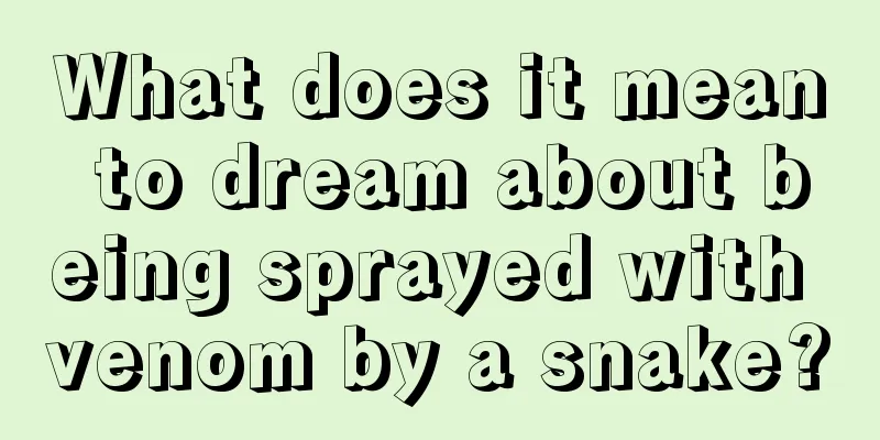 What does it mean to dream about being sprayed with venom by a snake?