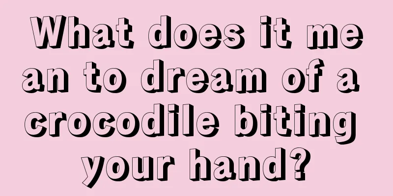 What does it mean to dream of a crocodile biting your hand?