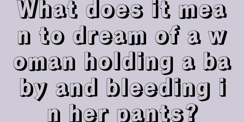 What does it mean to dream of a woman holding a baby and bleeding in her pants?