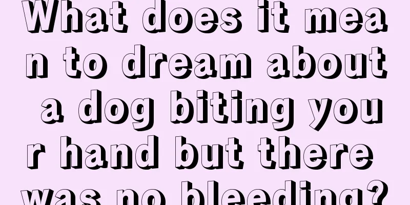 What does it mean to dream about a dog biting your hand but there was no bleeding?