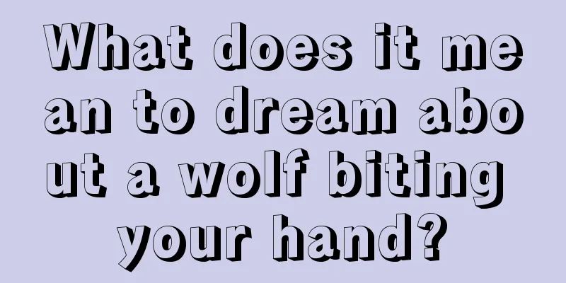 What does it mean to dream about a wolf biting your hand?