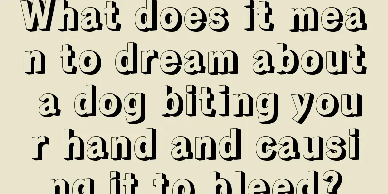 What does it mean to dream about a dog biting your hand and causing it to bleed?