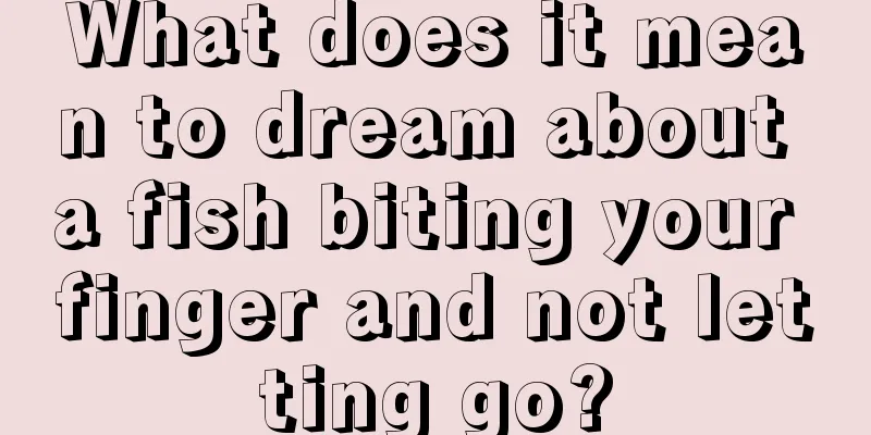 What does it mean to dream about a fish biting your finger and not letting go?