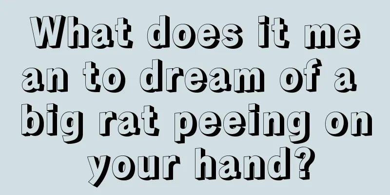 What does it mean to dream of a big rat peeing on your hand?