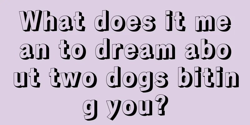 What does it mean to dream about two dogs biting you?