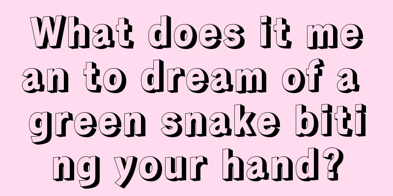 What does it mean to dream of a green snake biting your hand?