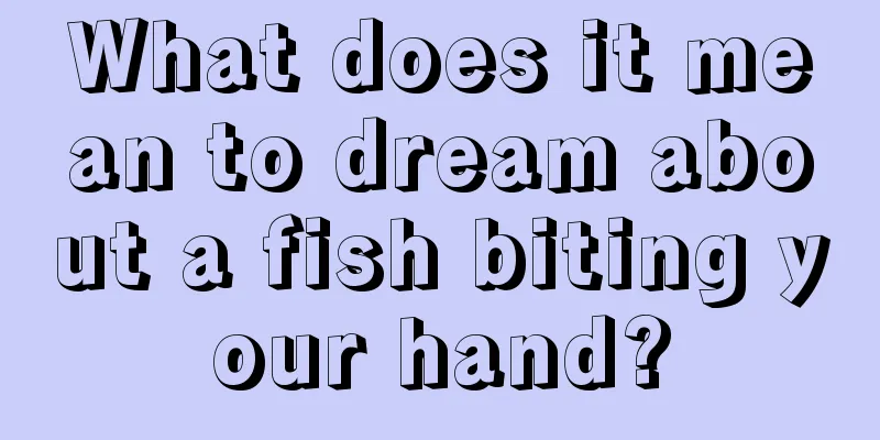 What does it mean to dream about a fish biting your hand?