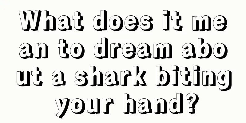 What does it mean to dream about a shark biting your hand?