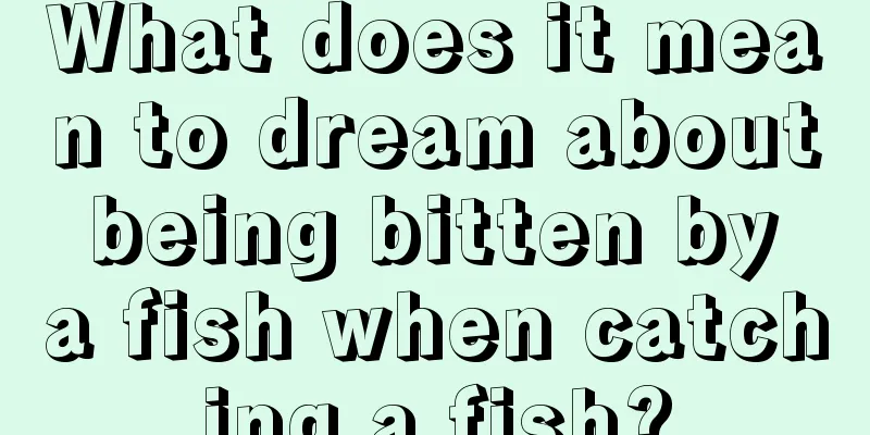 What does it mean to dream about being bitten by a fish when catching a fish?