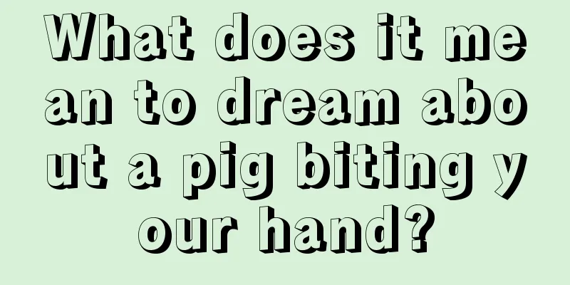 What does it mean to dream about a pig biting your hand?