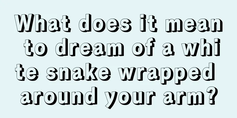 What does it mean to dream of a white snake wrapped around your arm?