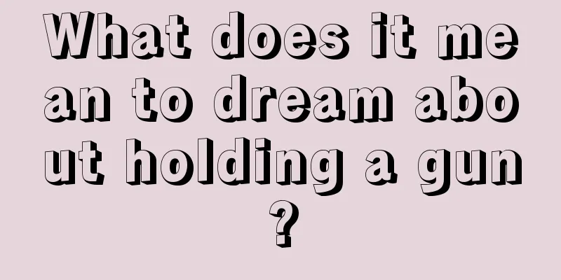 What does it mean to dream about holding a gun?