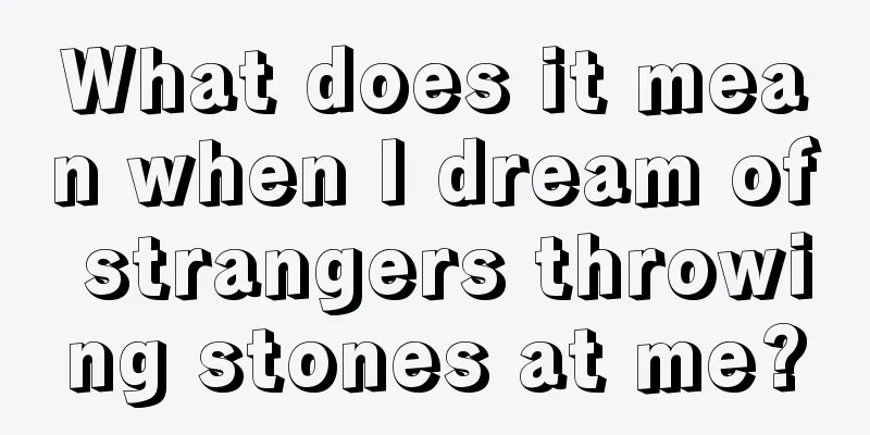 What does it mean when I dream of strangers throwing stones at me?