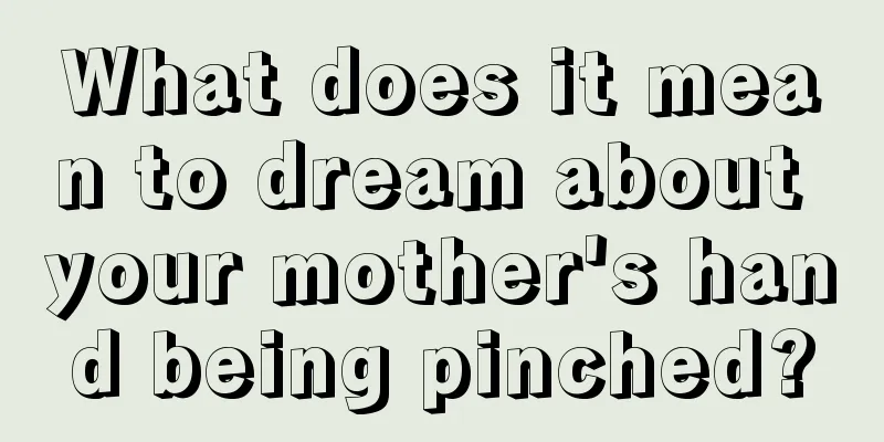 What does it mean to dream about your mother's hand being pinched?