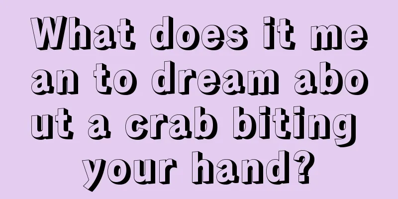 What does it mean to dream about a crab biting your hand?