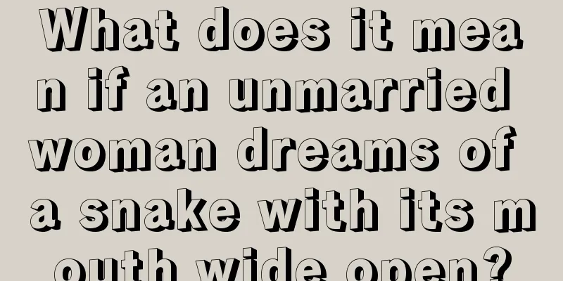 What does it mean if an unmarried woman dreams of a snake with its mouth wide open?