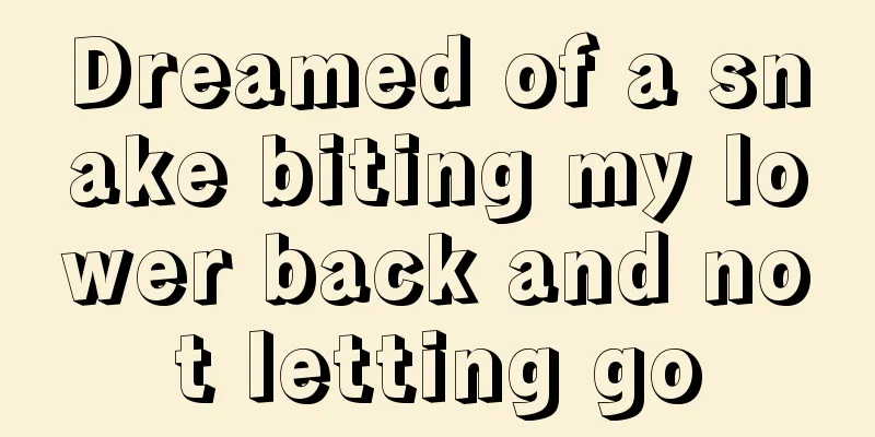 Dreamed of a snake biting my lower back and not letting go