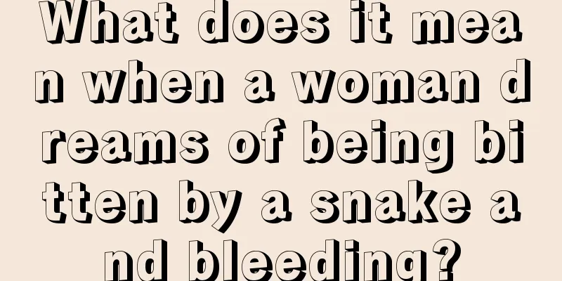 What does it mean when a woman dreams of being bitten by a snake and bleeding?