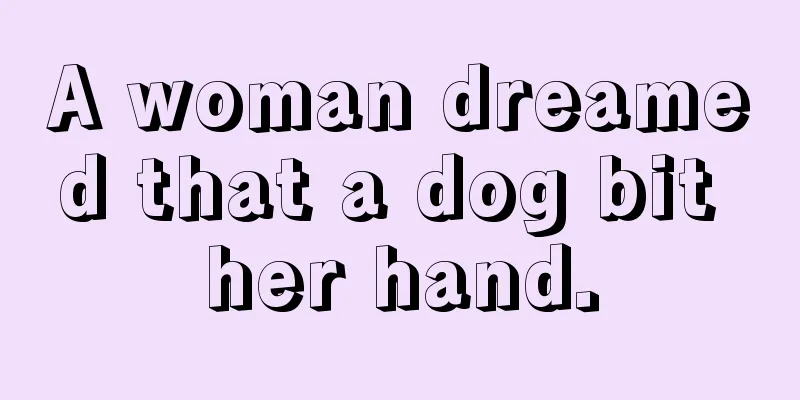 A woman dreamed that a dog bit her hand.