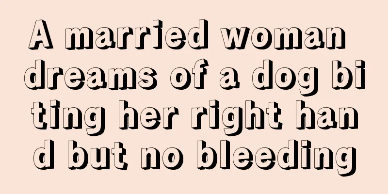 A married woman dreams of a dog biting her right hand but no bleeding