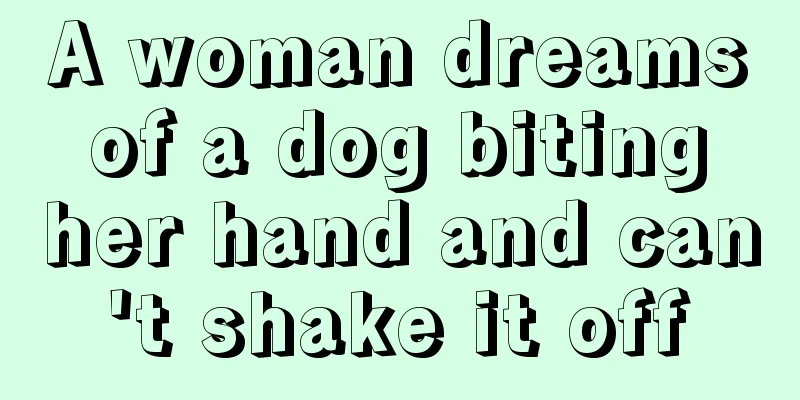 A woman dreams of a dog biting her hand and can't shake it off