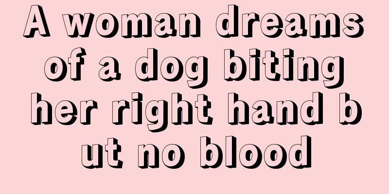 A woman dreams of a dog biting her right hand but no blood