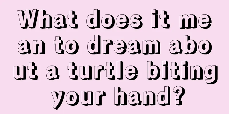 What does it mean to dream about a turtle biting your hand?