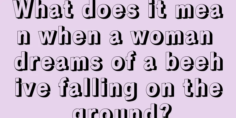 What does it mean when a woman dreams of a beehive falling on the ground?