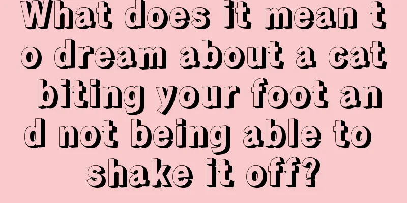 What does it mean to dream about a cat biting your foot and not being able to shake it off?