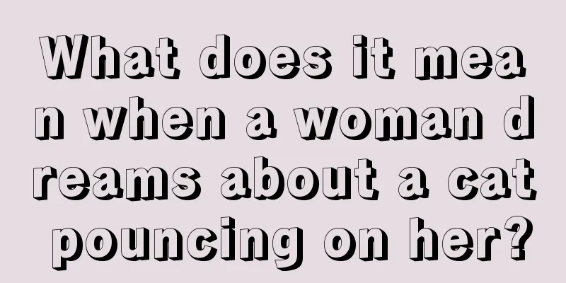 What does it mean when a woman dreams about a cat pouncing on her?