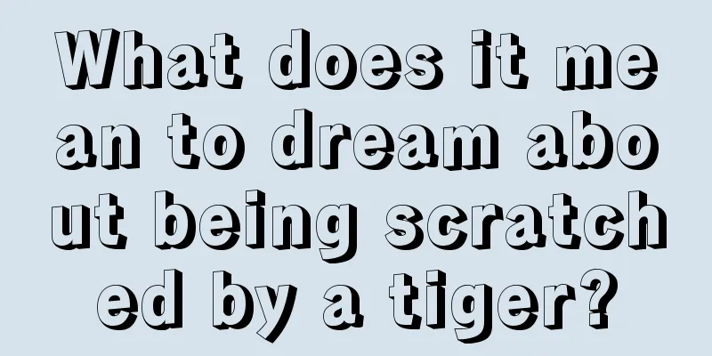 What does it mean to dream about being scratched by a tiger?