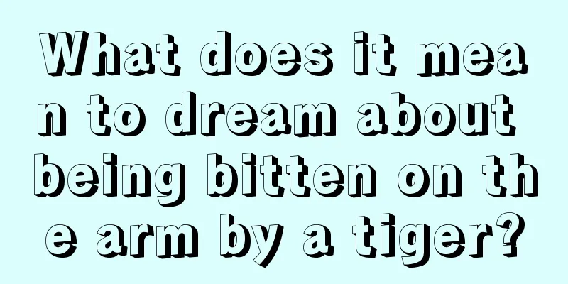 What does it mean to dream about being bitten on the arm by a tiger?