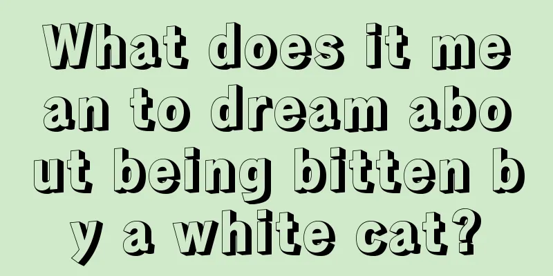 What does it mean to dream about being bitten by a white cat?