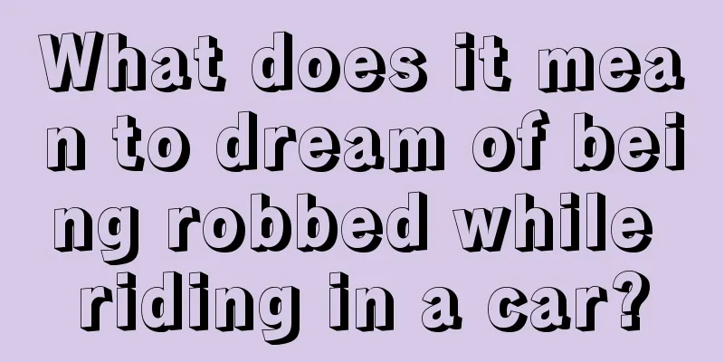 What does it mean to dream of being robbed while riding in a car?