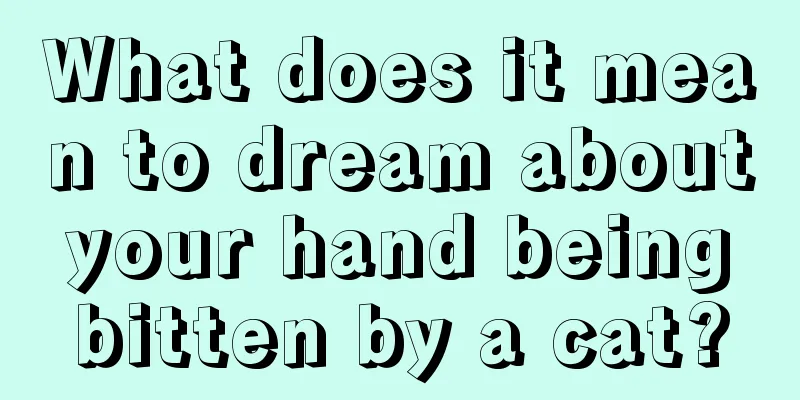 What does it mean to dream about your hand being bitten by a cat?