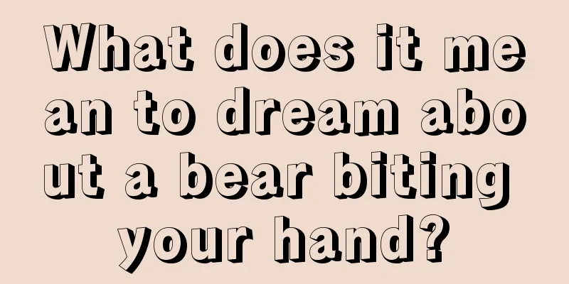 What does it mean to dream about a bear biting your hand?