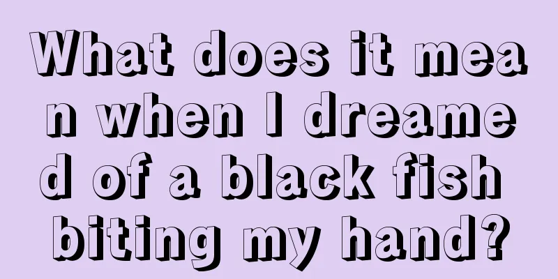 What does it mean when I dreamed of a black fish biting my hand?