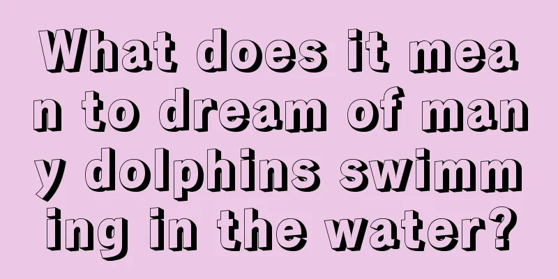 What does it mean to dream of many dolphins swimming in the water?