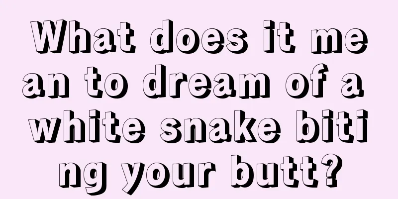 What does it mean to dream of a white snake biting your butt?